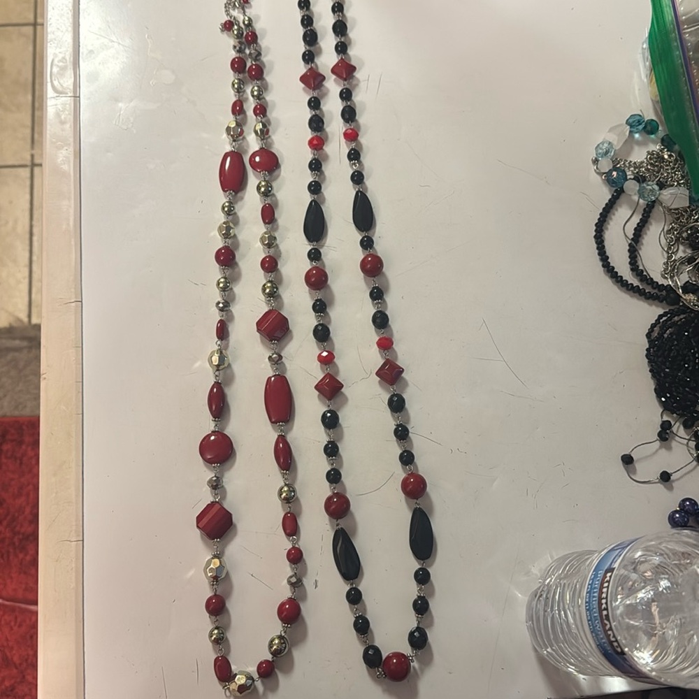 2 red necklaces/ costume jewelry